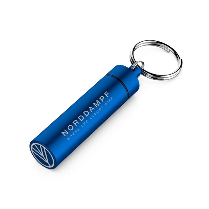 Norddampf Relict Capsule Caddy aus Aluminium in Blau liegend, Schlüsselanhänger für Dosierkapseln